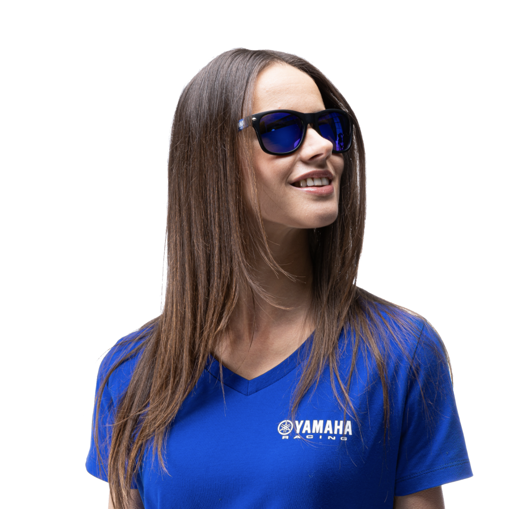 Young brunette woman with Yamaha blue Tshirt and blue sunglasses.
