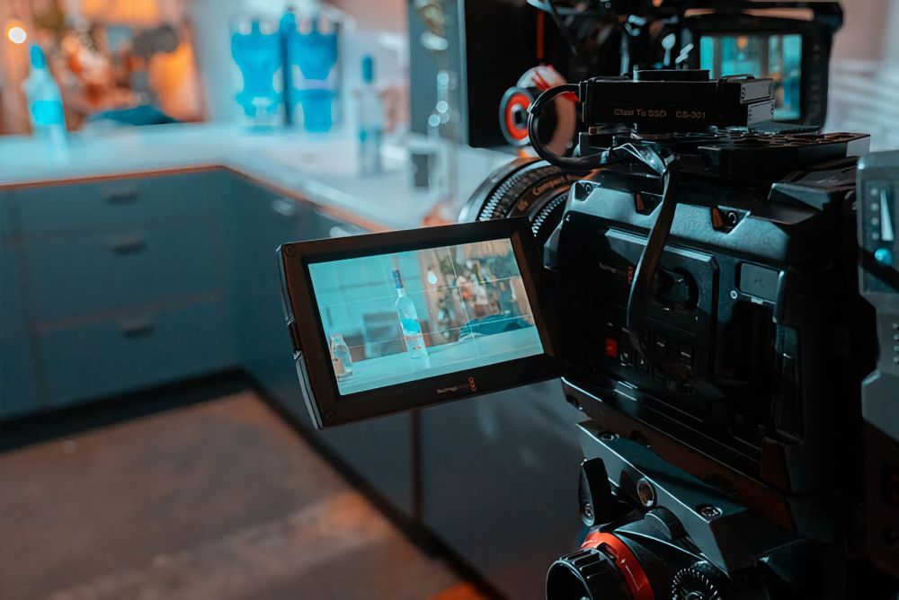Looking at the camera monitor on the Grey Goose Live Like film set.