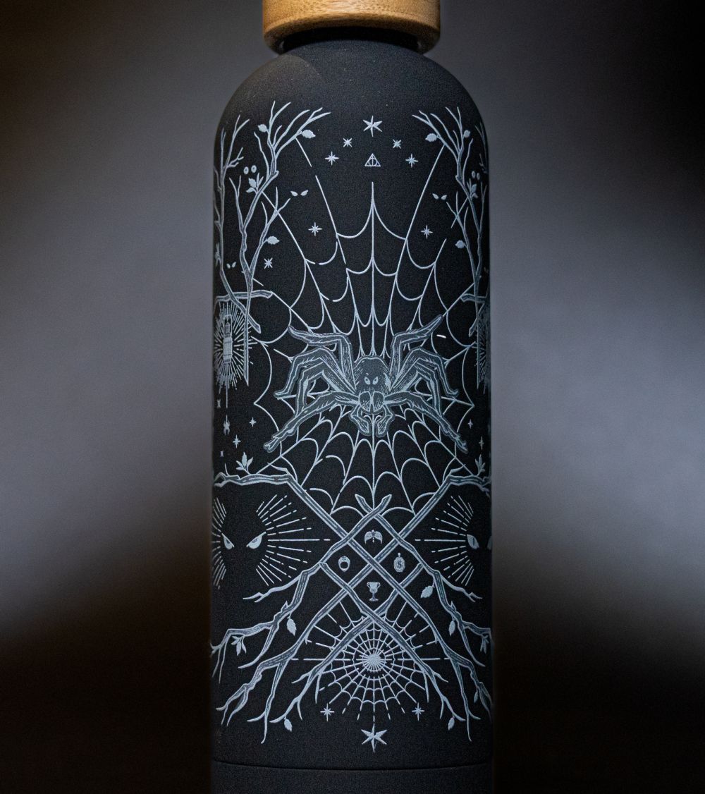 A water bottle with Aragog artwork.
