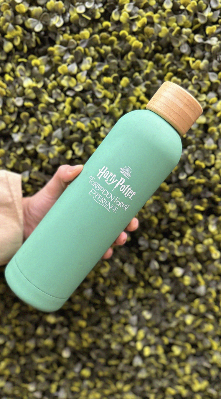 Green water bottle held up.