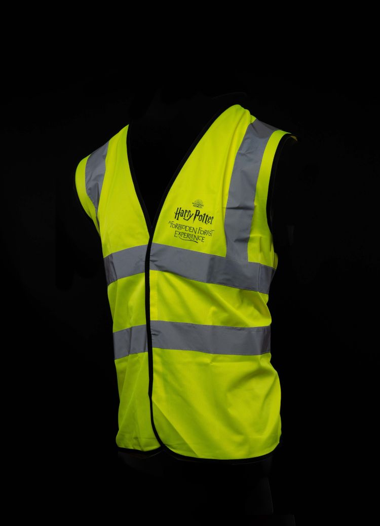 A high vis jacket with the Forbidden Forest logo on the front.