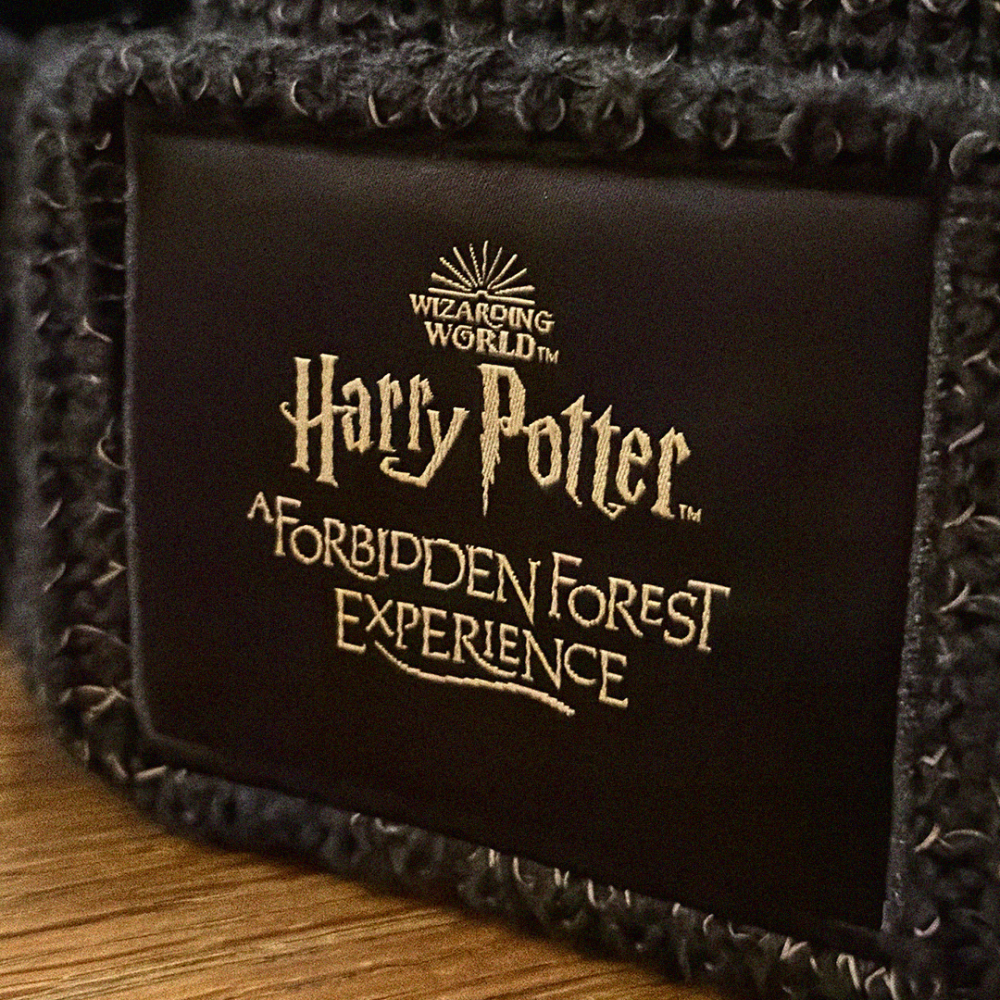 Forbidden Forest brown badge.