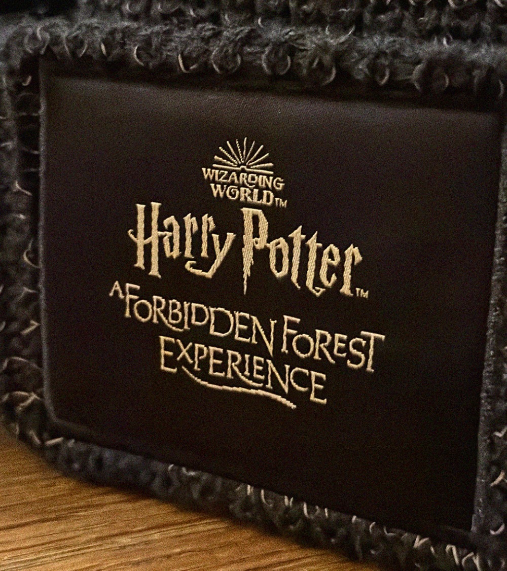 Forbidden Forest brown badge.