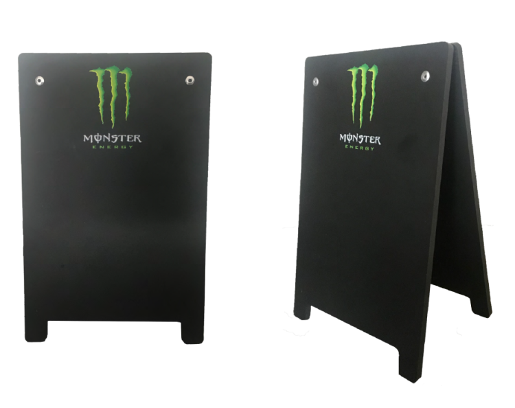 A double-sided board with Monster branding.