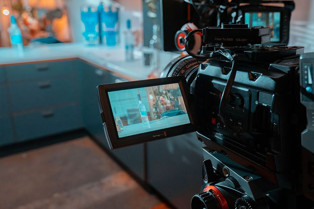 Looking at the camera monitor on the Grey Goose Live Like film set.
