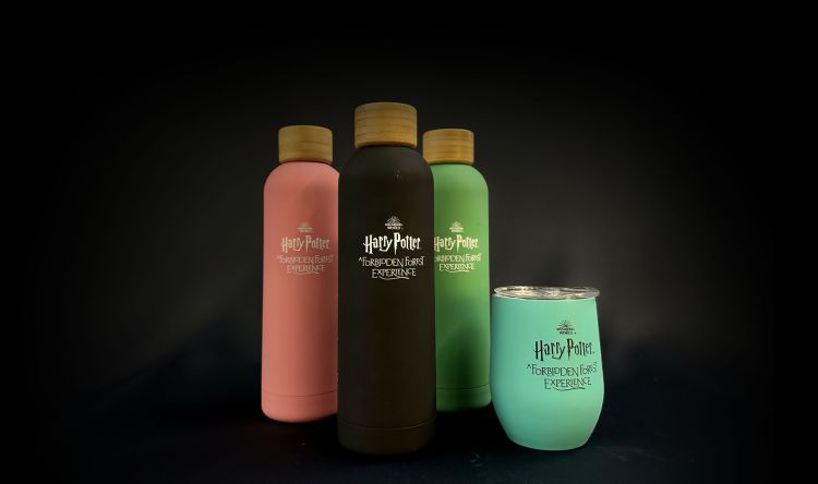 Various Forbidden Forest-branded mugs and flasks.