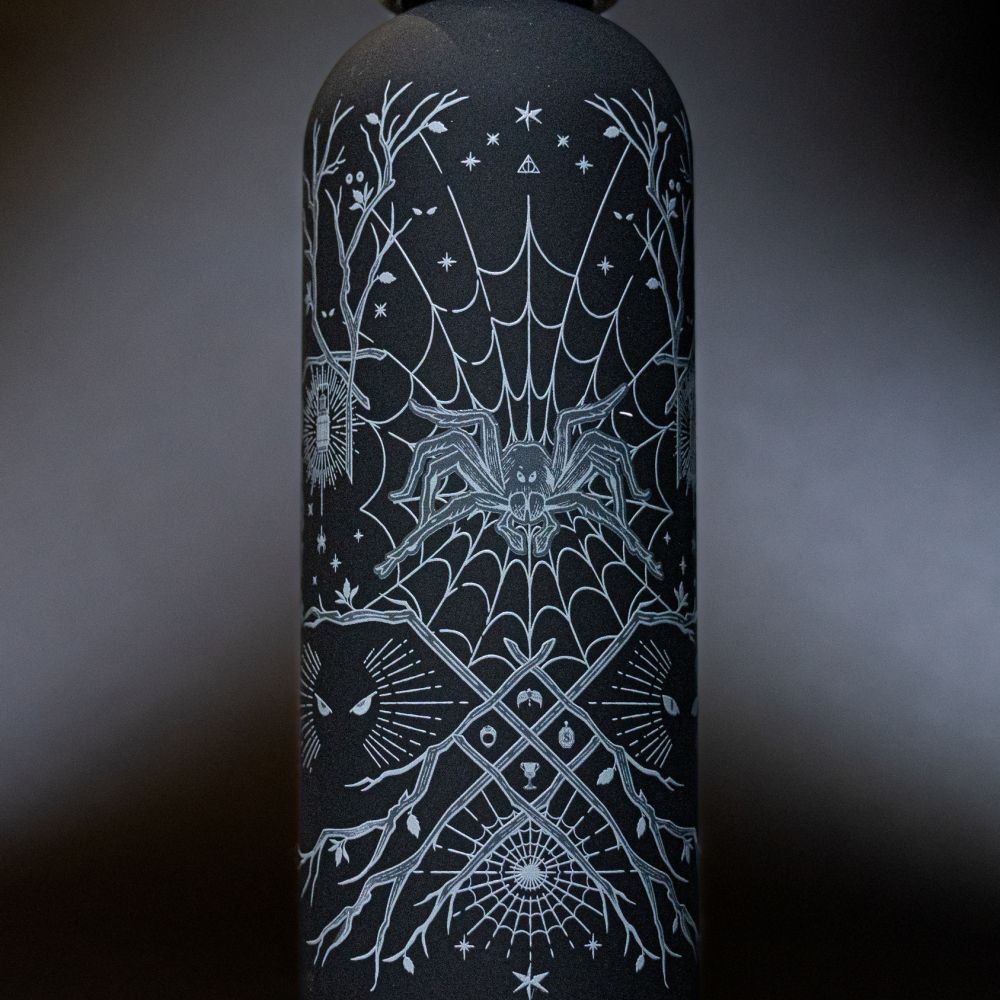 A water bottle with Aragog artwork.