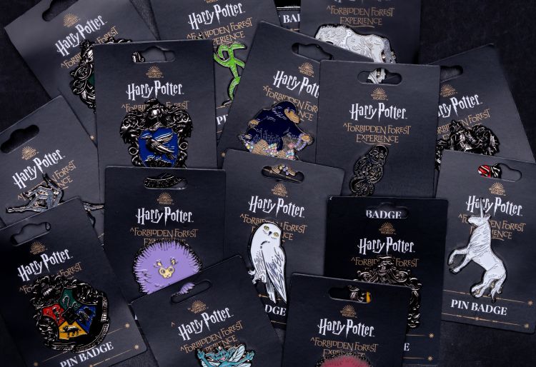 various Forbidden Forest pin badges.